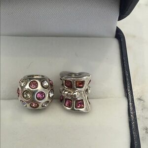 Set of two Chamilia Sterling Silver Charm Set (missing stones)